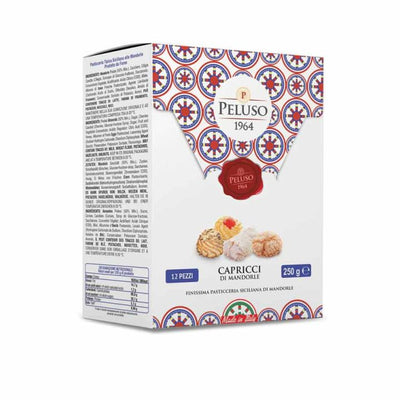 A box of Peluso 1964 Capricci di Mandorla cookies, featuring a white box with a colorful Mediterranean tile pattern and illustrations of the cookies.