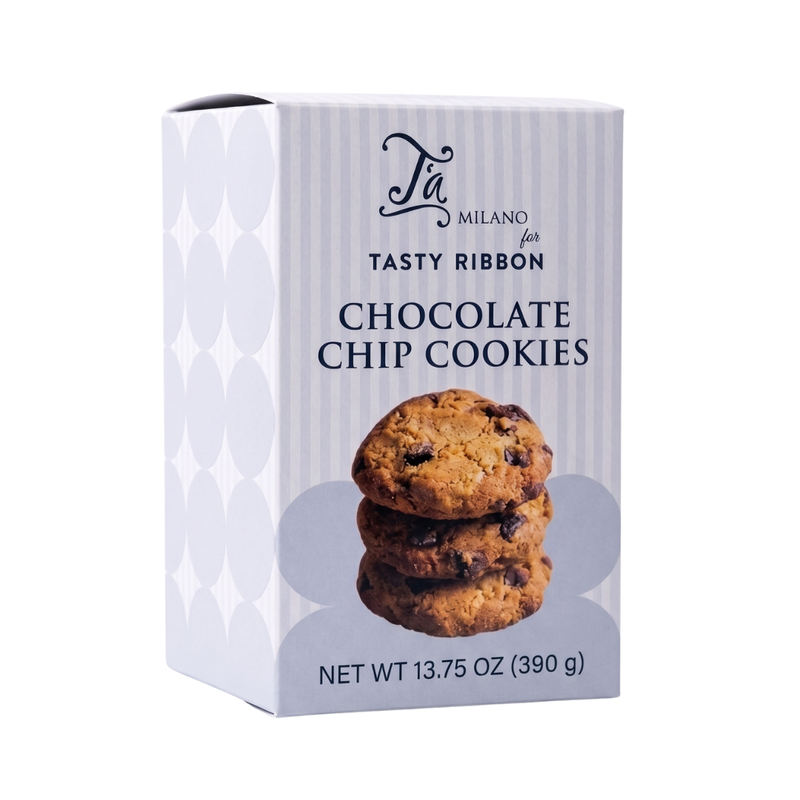 A box of Tà Milano for Tasty Ribbon Chocolate Chip Cookies, featuring a white and light gray patterned box with a photo of three chocolate chip cookies on the front.